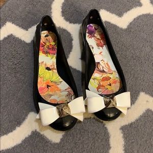 Ted Baker black with white bow jelly flats